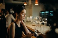 Woman Leaning on Table