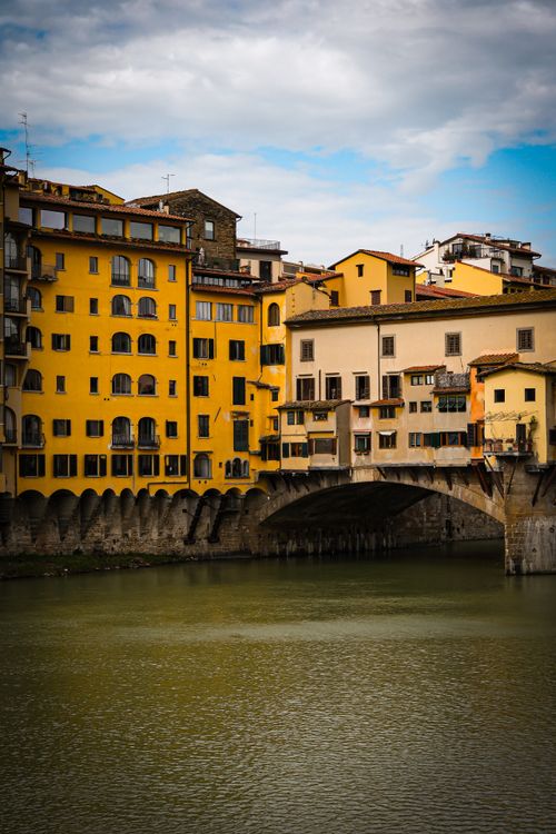 Free Scenic view of Ponte Vecchio over the Arno River in Florence, Italy. Stock Photo