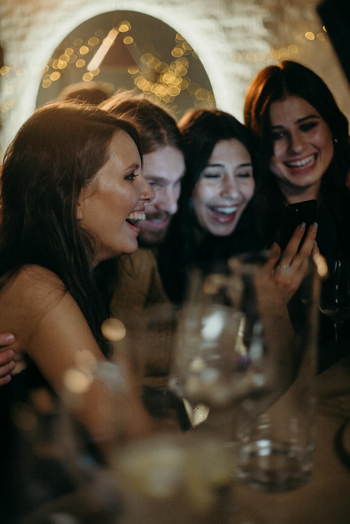 Group of friends toasting and celebrating at holiday party