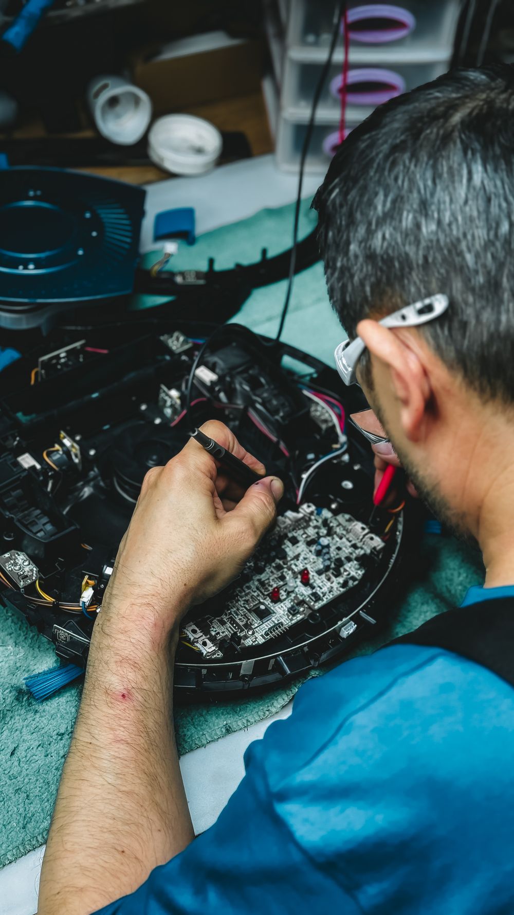 PLC control board being repaired at the bench