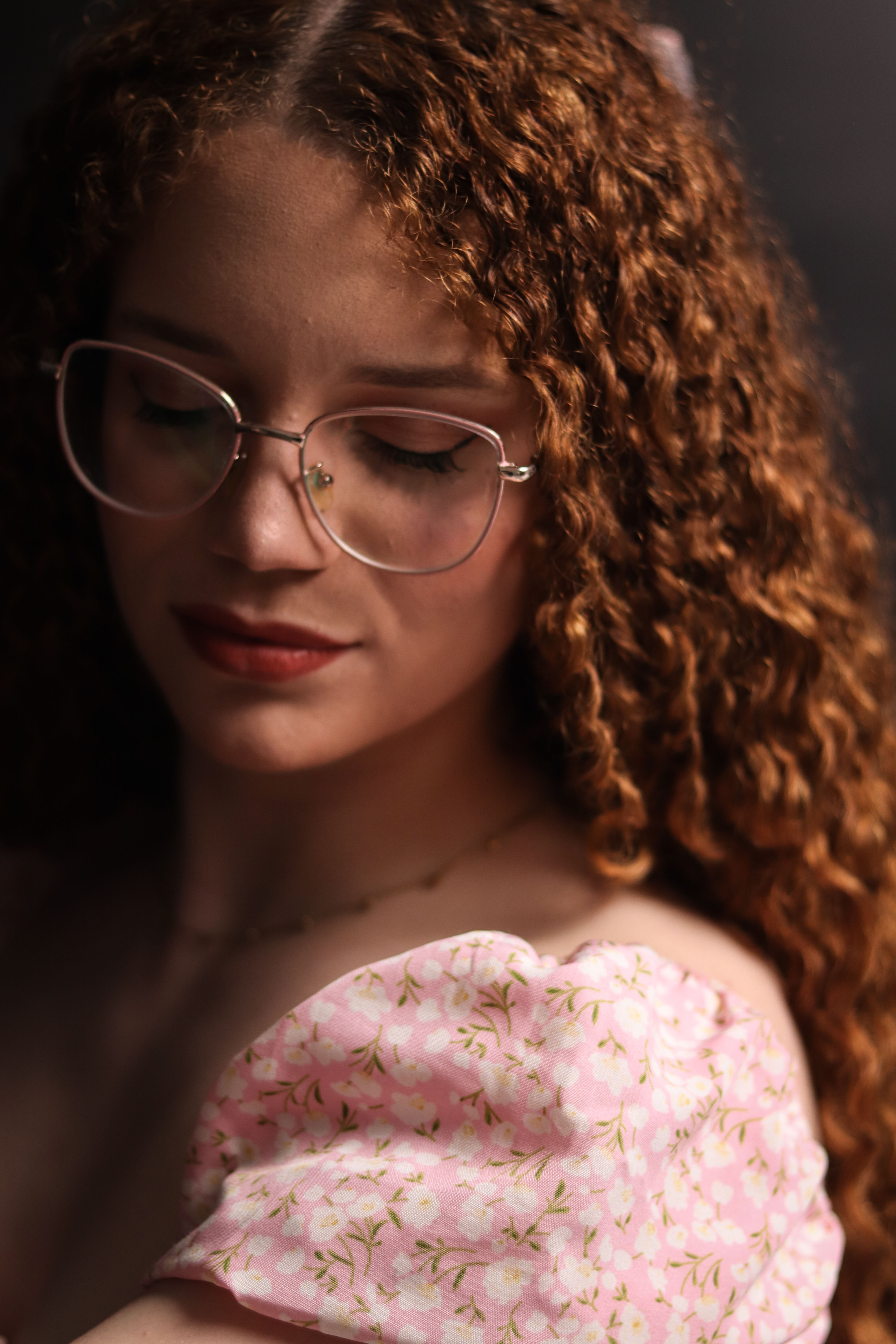 Portrait of Woman with Curly Hair and Glasses · Free Stock Photo