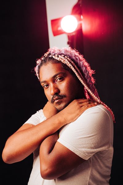 Portrait under red studio light — Emanuel Pedro on Pexels
