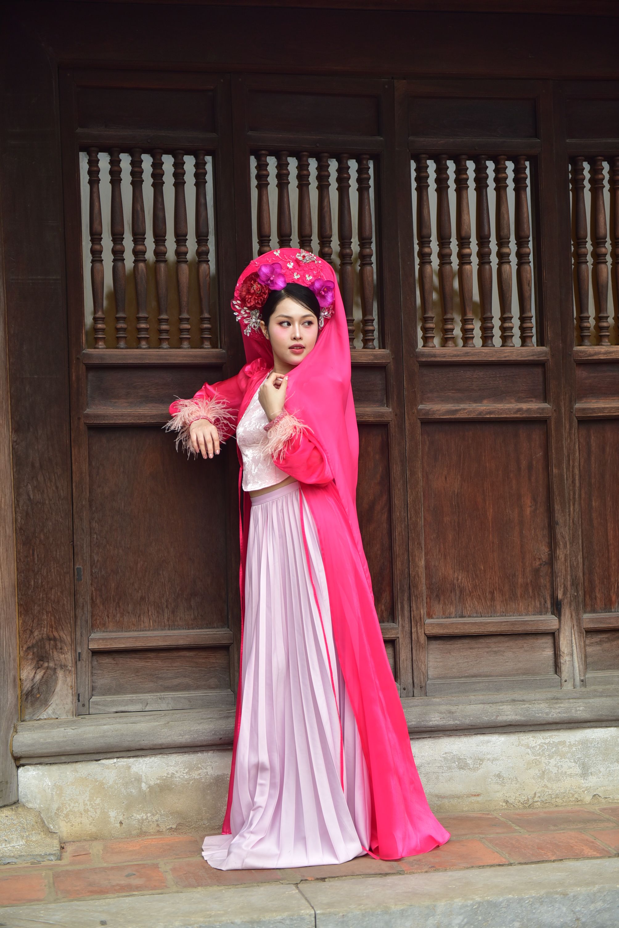 Woman in Traditional Pink Dress by Wooden Door · Free Stock Photo