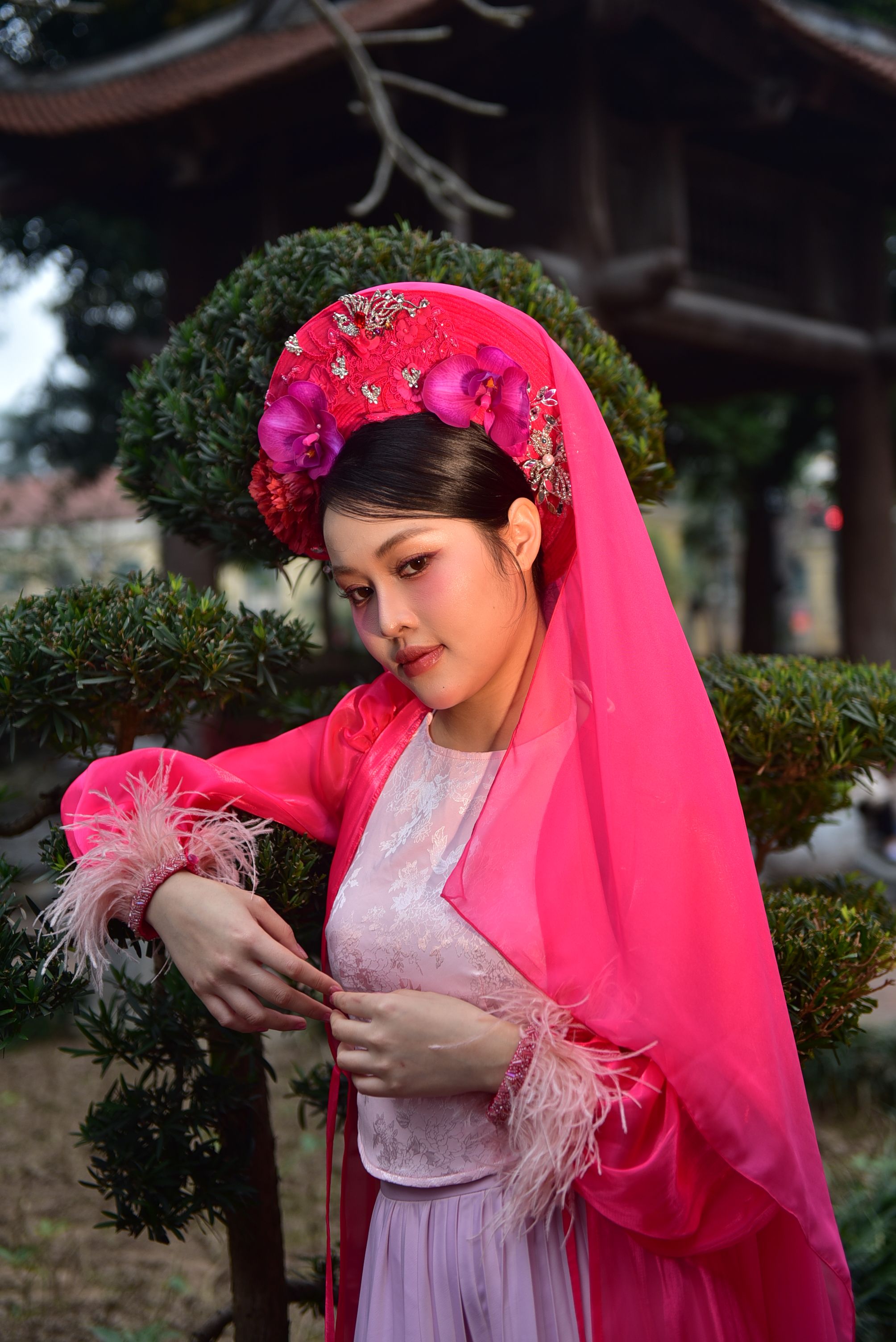 Elegant Woman in Traditional Pink Dress Outdoors · Free Stock Photo
