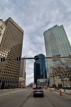 Scenic downtown Winnipeg with towering skyscrapers and a bustling street scene.