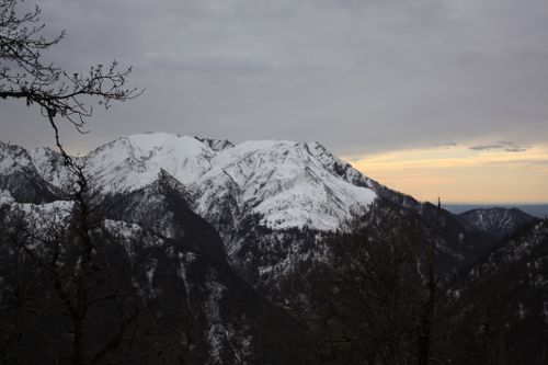 Free Scenic view of snow-covered mountains during sunset in winter. Stock Photo