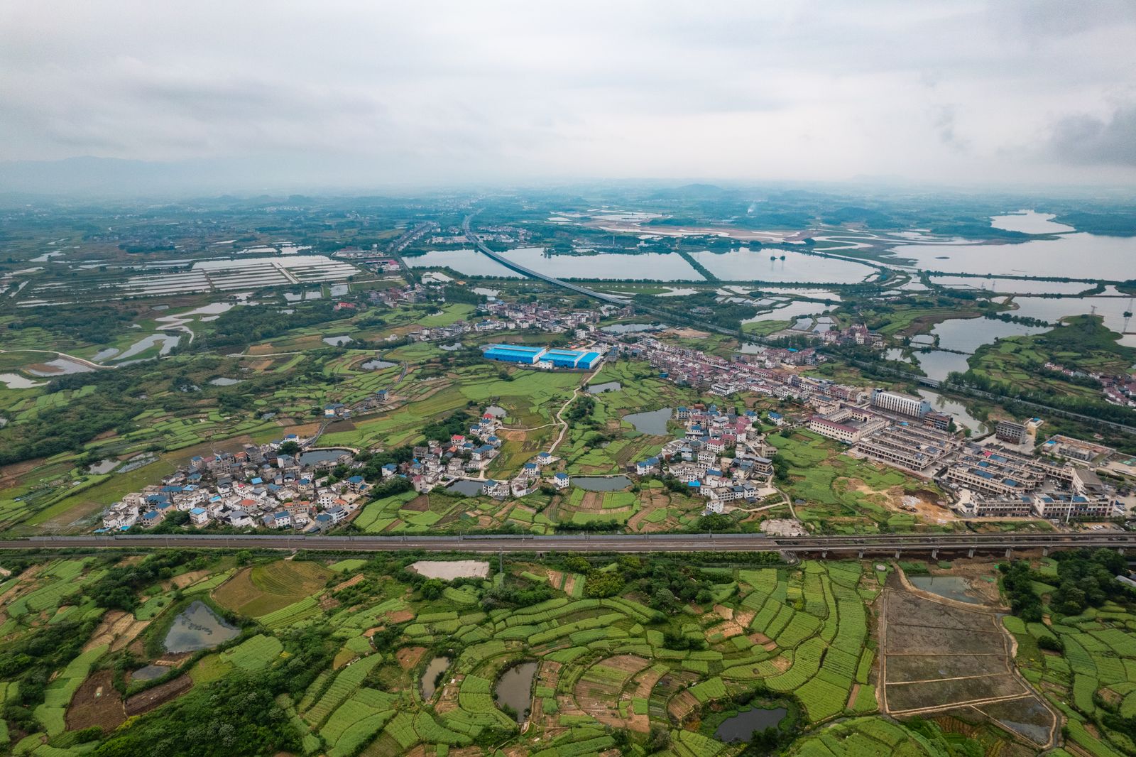 Aerial View of Croplands and Houses · Free Stock Photo