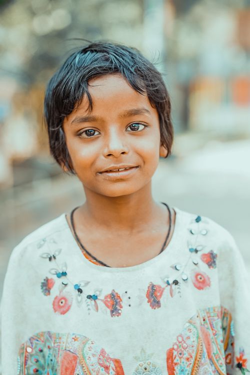 Free Captivating portrait of a smiling child in vibrant clothing, taken in Navi Mumbai, India. Stock Photo