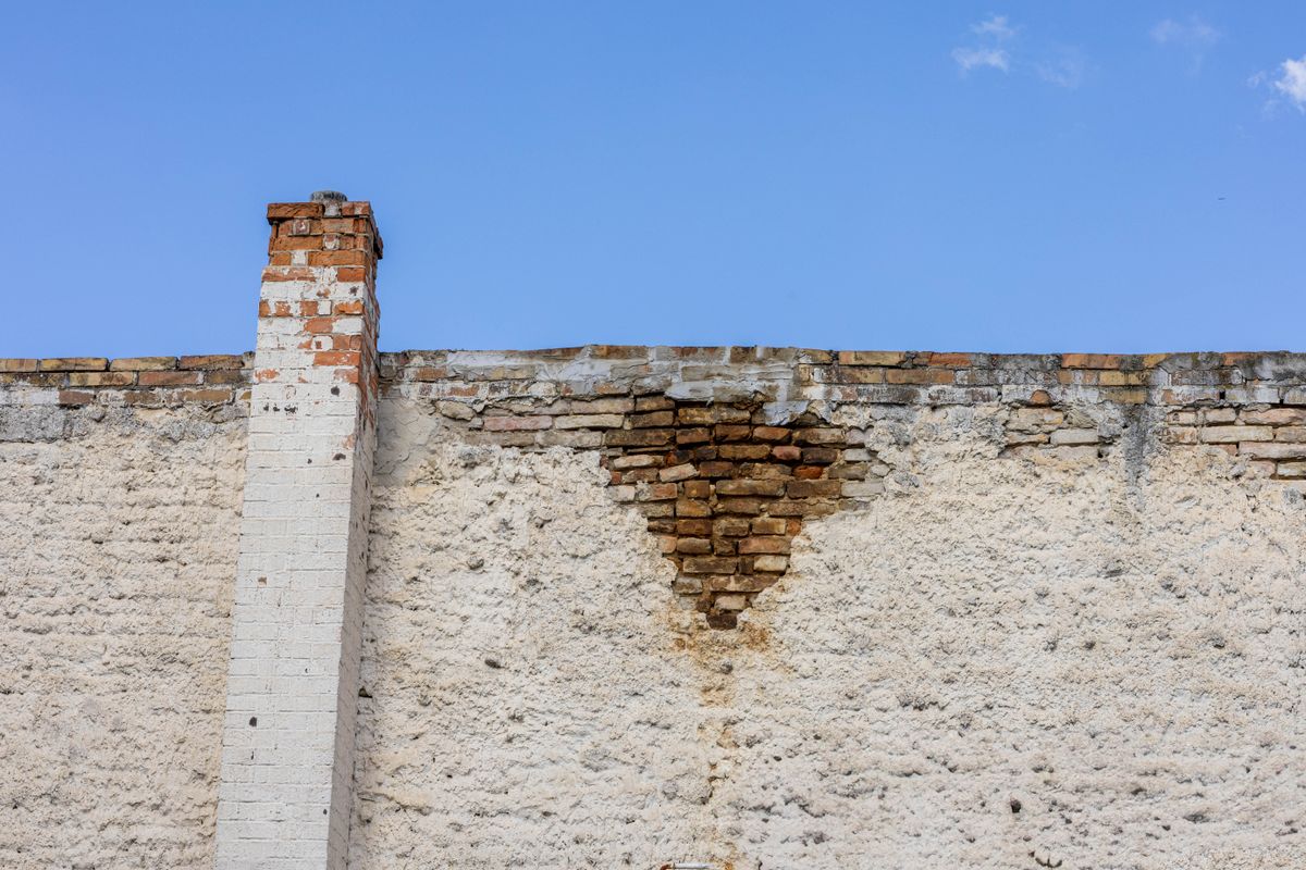 Brick chimney against a blue sky