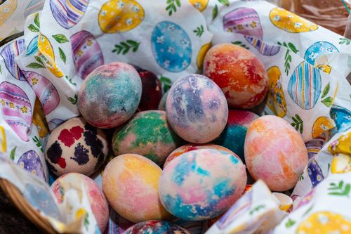 Free Vibrant Easter eggs in a festive basket symbolize joy and celebration. Stock Photo
