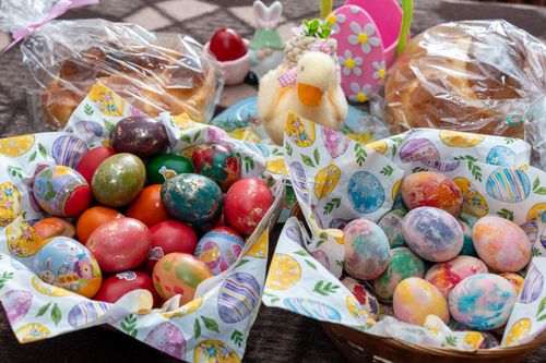 Free Vibrant decorated Easter eggs in baskets, perfect for spring celebrations. Stock Photo