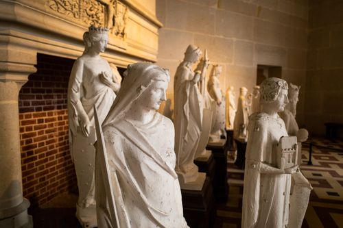 Free Series of historic statues on display inside Pierrefonds Castle, France, showcasing gothic architecture. Stock Photo