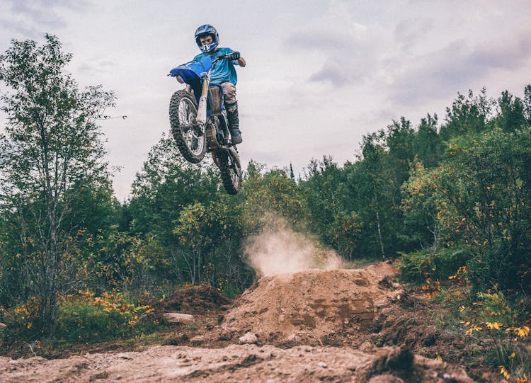 Man Riding Motocross Dirt Bike