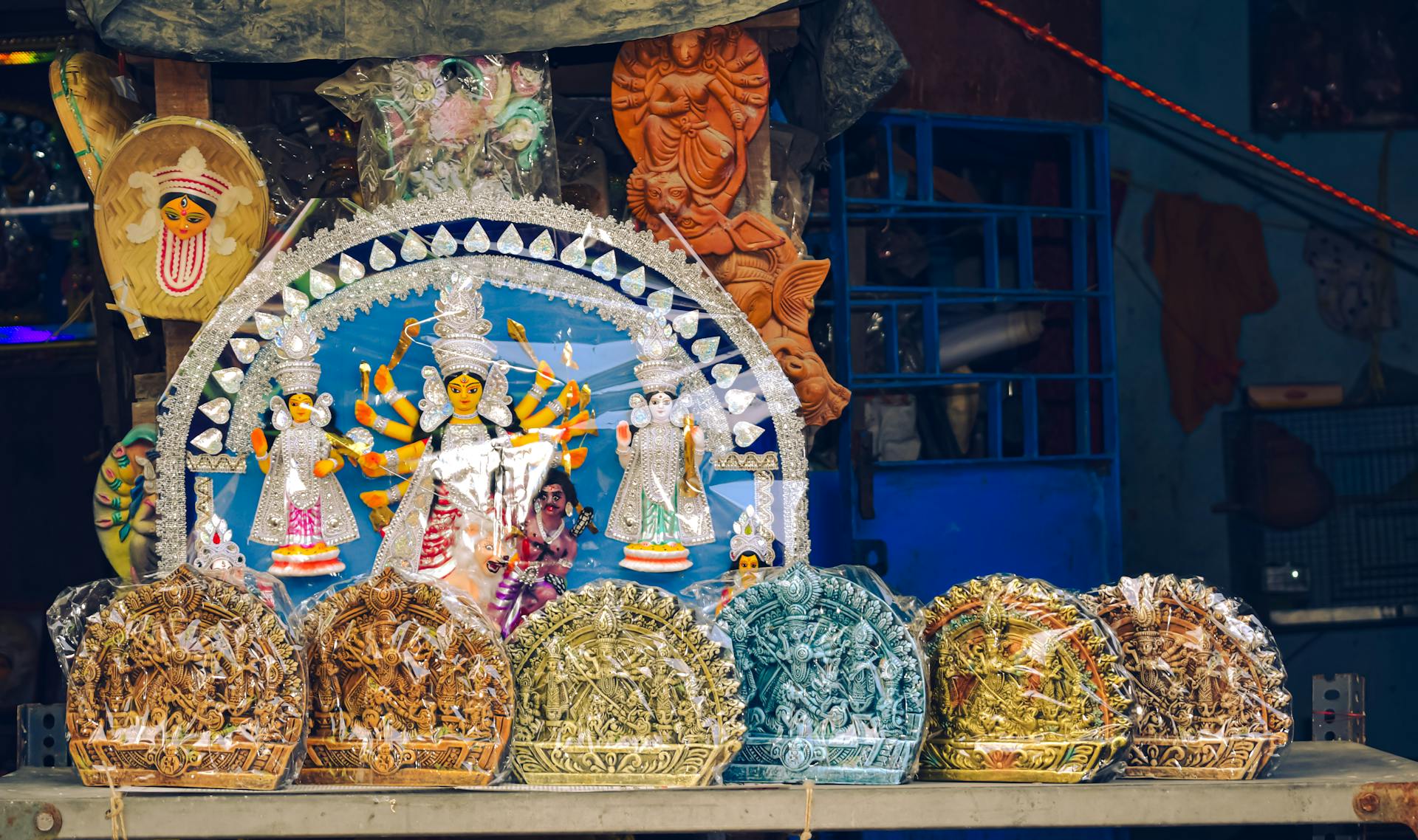 Beautifully crafted Durga idols in a vibrant Kolkata market showcase traditional craftsmanship and Hindu culture.