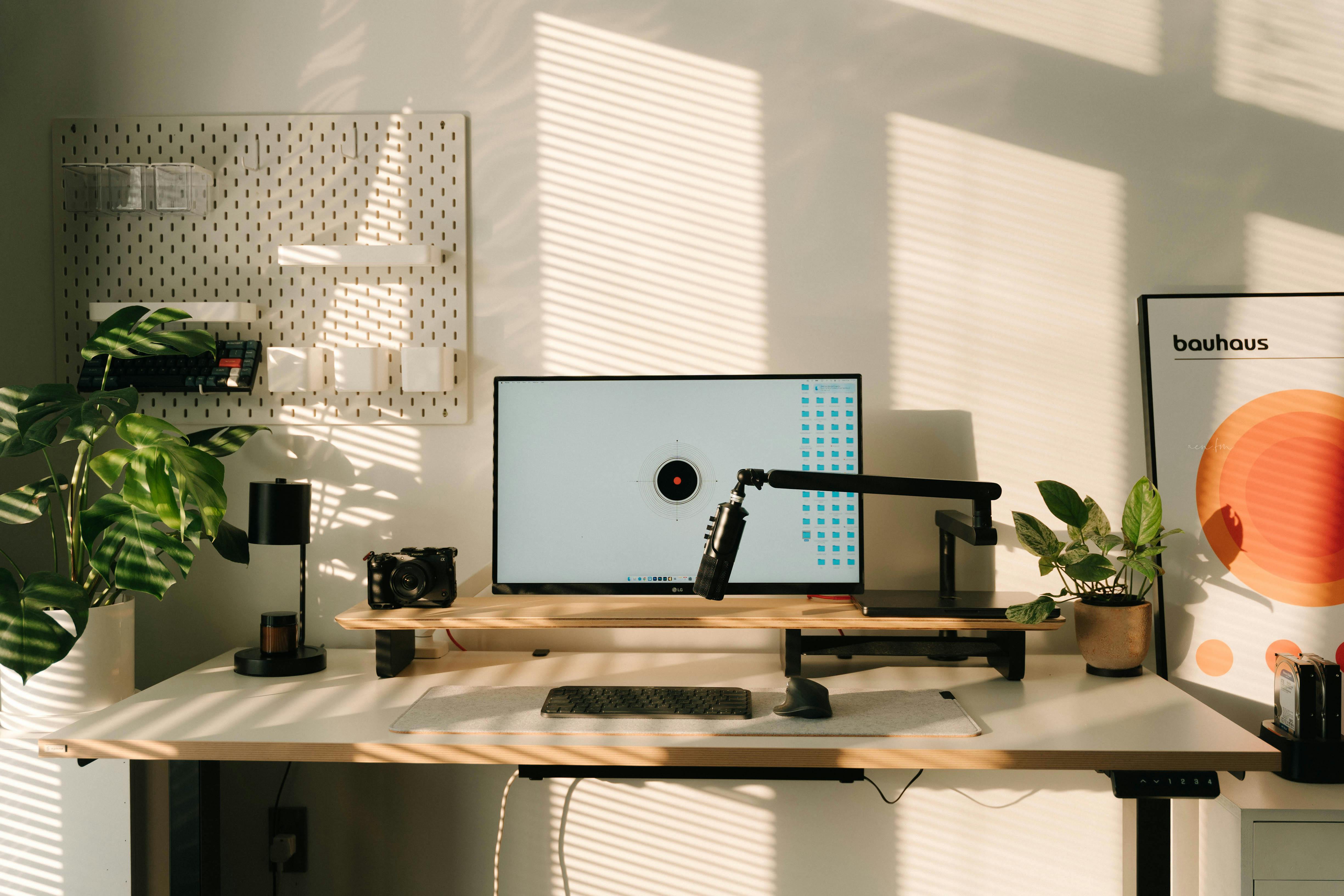 Well-lit Workspace With Natural Light And Adjustable Desk Lamp