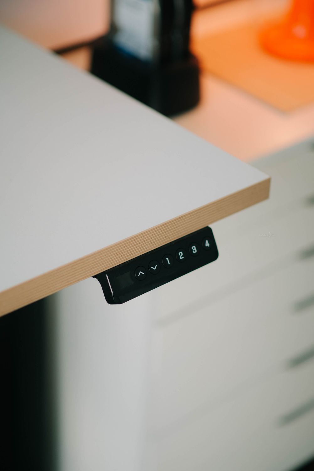 Modern adjustable height desk with control panel · Free Stock Photo