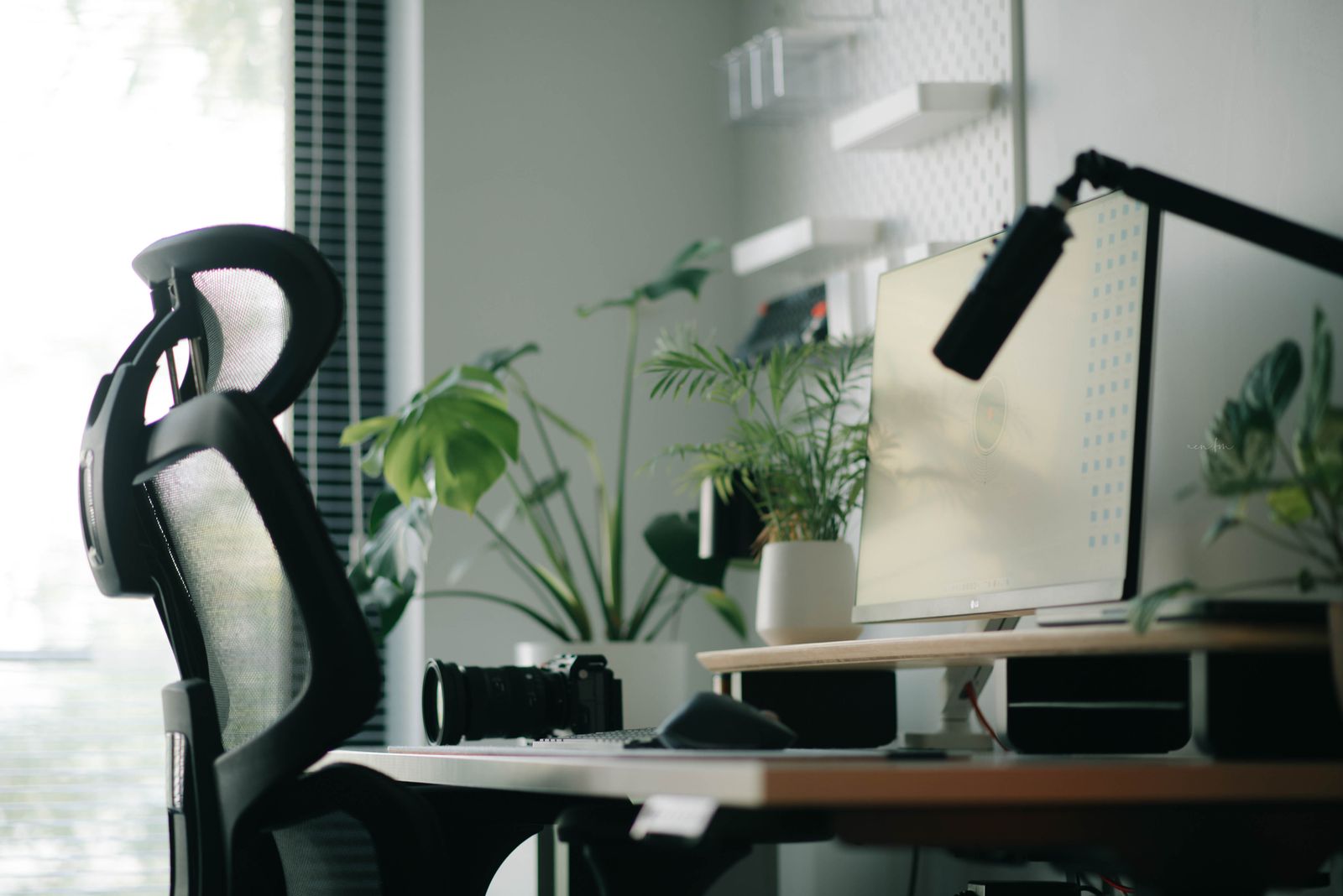 Organized modern workstation with an ergonomic chair and desktop accessories