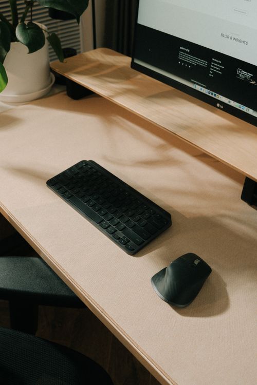Modern Workspace with Keyboard and Mouse · Free Stock Photo