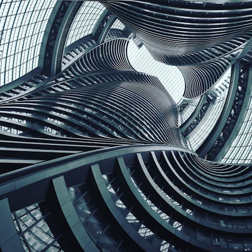 Free Low-angle Photography of Gray Spiral Building Stock Photo