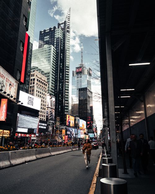 Free Bustling Times Square with skyscrapers and digital billboards in New York City. Stock Photo