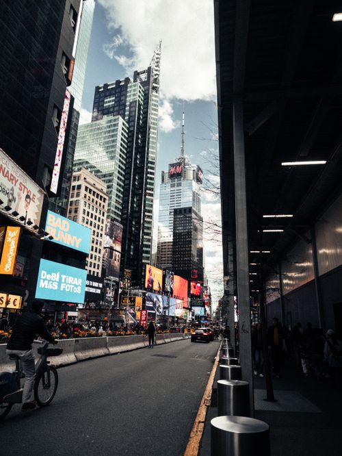 Free Dynamic view of Times Square with bustling street life and iconic skyscrapers. Stock Photo