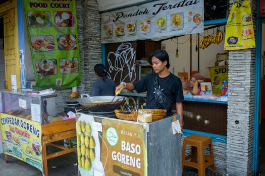 Street food vendor preparing bakso goreng at a food stall in Bogor, West Java, Indonesia.