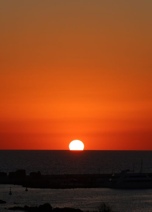Free Stunning sunset over the Mediterranean Sea in Cyprus, capturing vibrant orange hues. Stock Photo