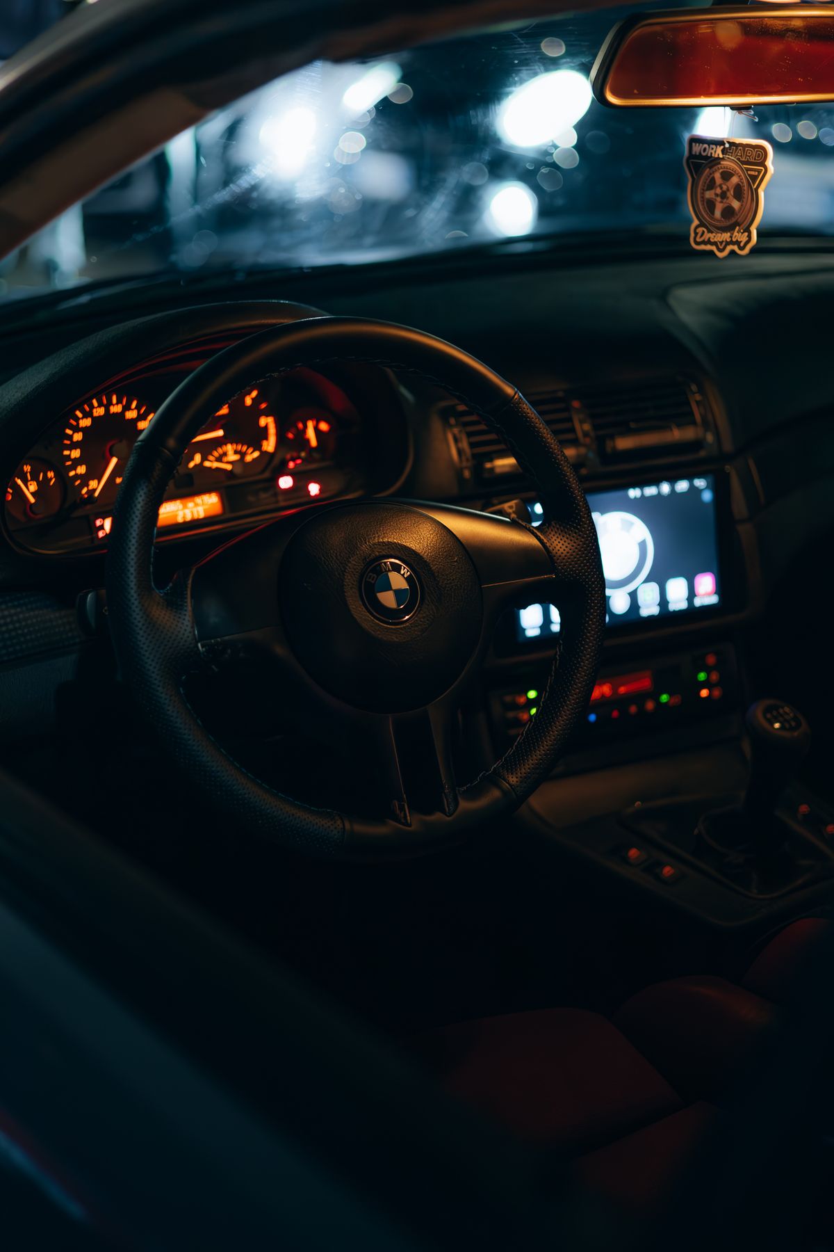 Real premium vehicle cabin with dashboard technology and restrained ambient interior lighting