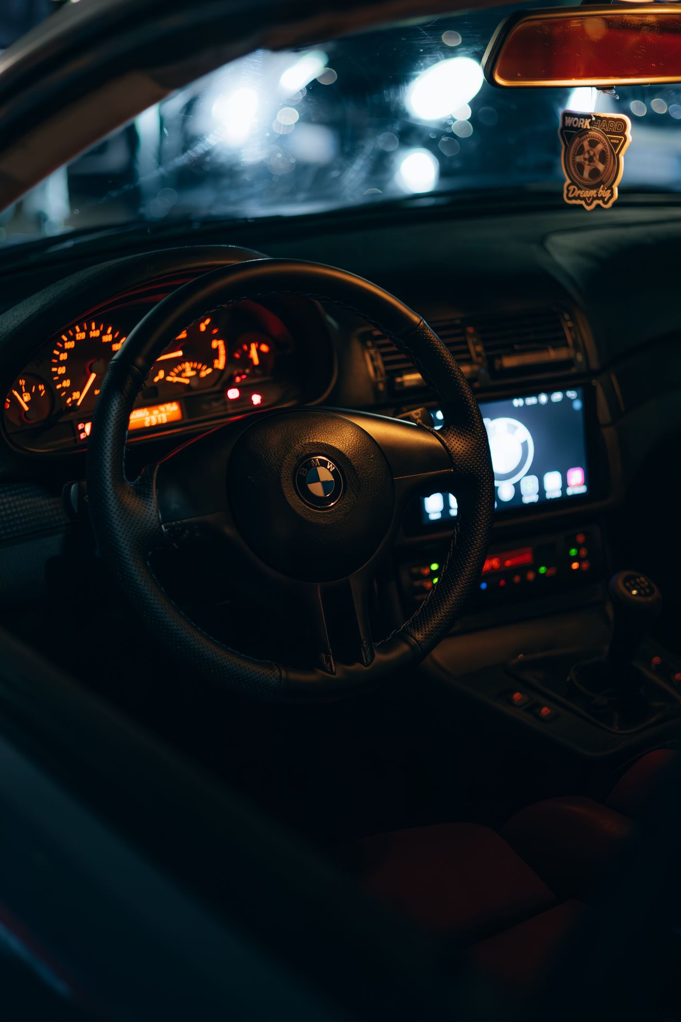 Real premium vehicle interior at night with restrained ambient cabin lighting