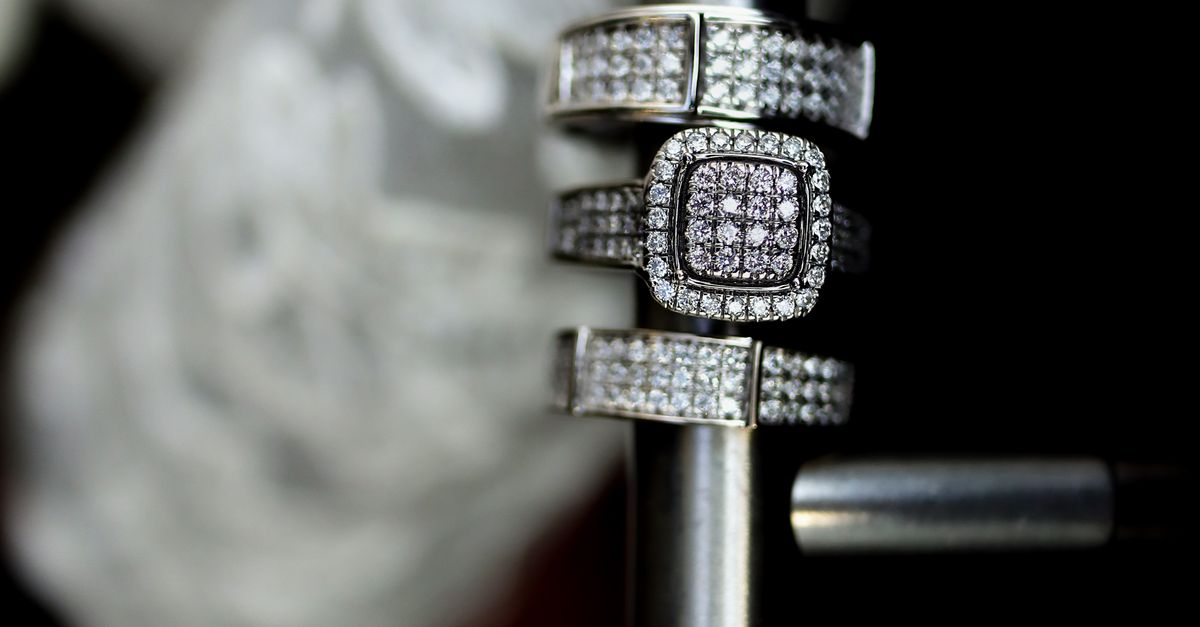 Elegant Silver Diamond Wedding Rings on Display · Free Stock Photo