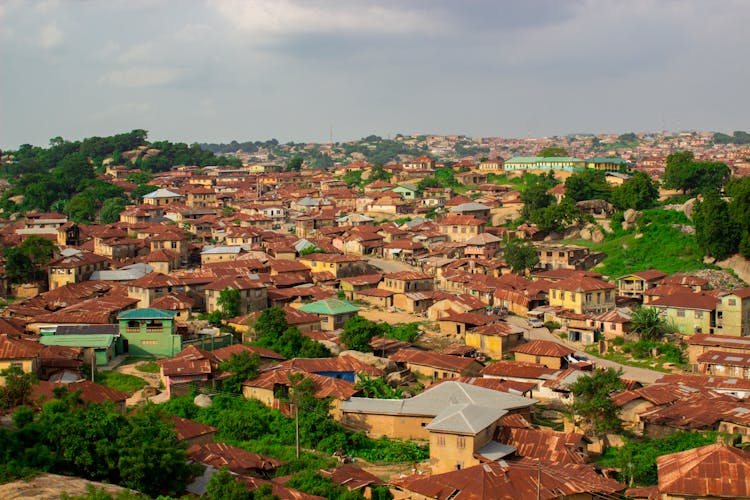 Top View Of Houses And Building Roofs