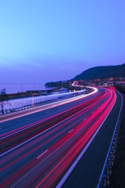Free Stunning long exposure shot of highway lights in Huskvarna, Sweden during the evening. Stock Photo