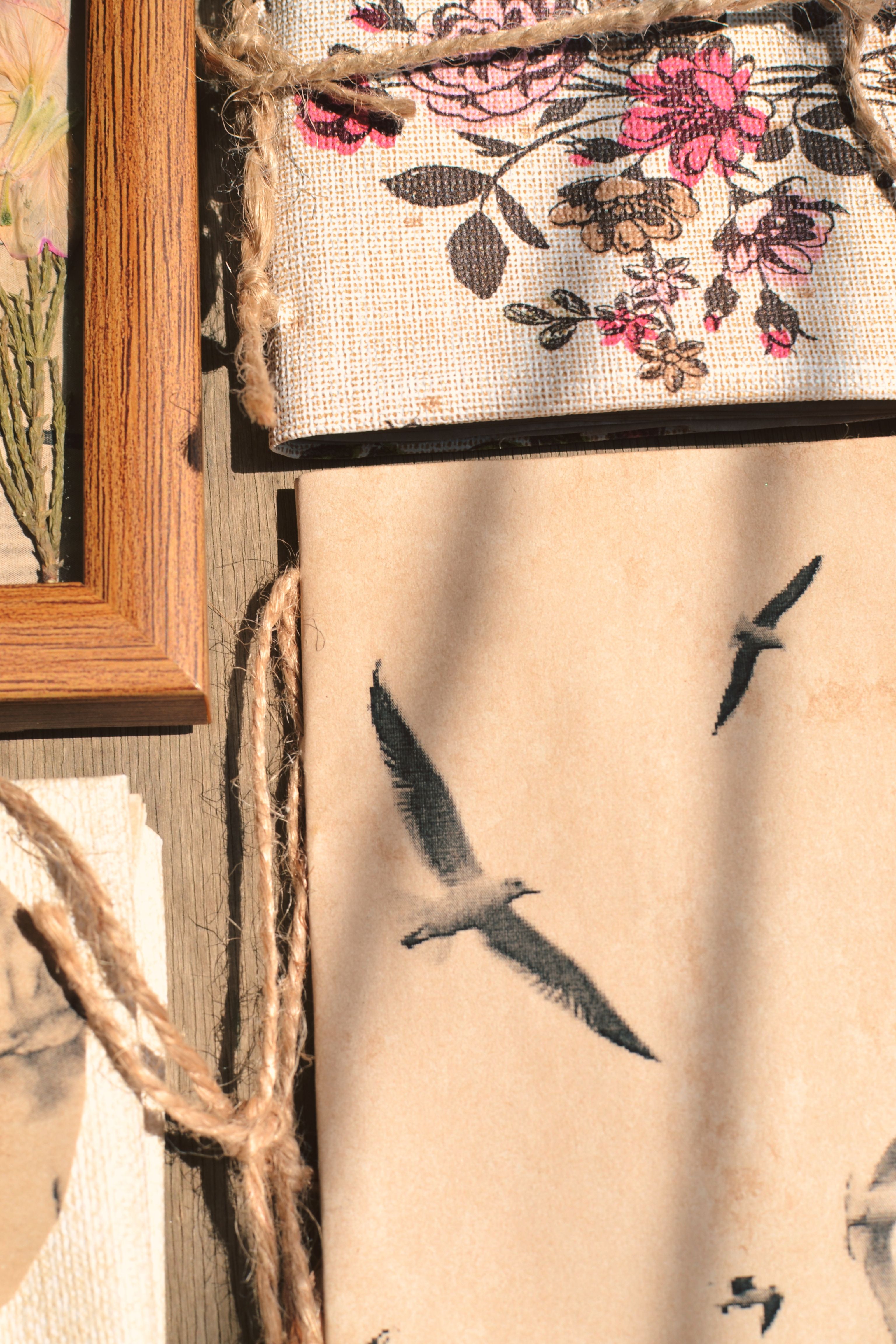 Charming vintage artwork featuring seagulls and floral patterns in soft warm light.