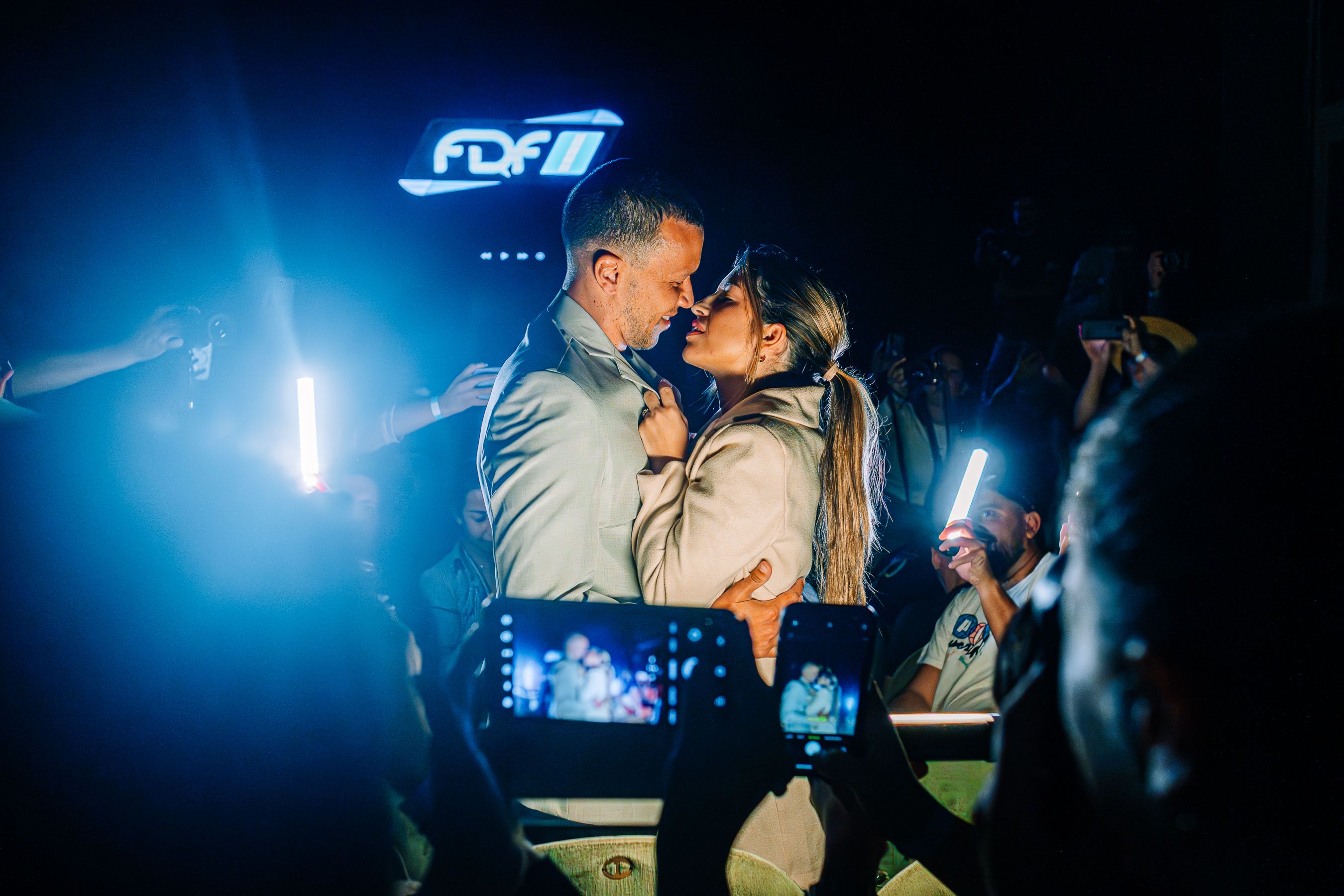 Romantic couple in close tender hold under soft night ambiance, evoking aftermath of profound intimacy and peace