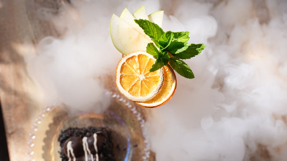 KitchenAid vs Cosori: Jerky Drying Showdown Sliced citrus and mint leaves beautifully arranged on a smoky background.