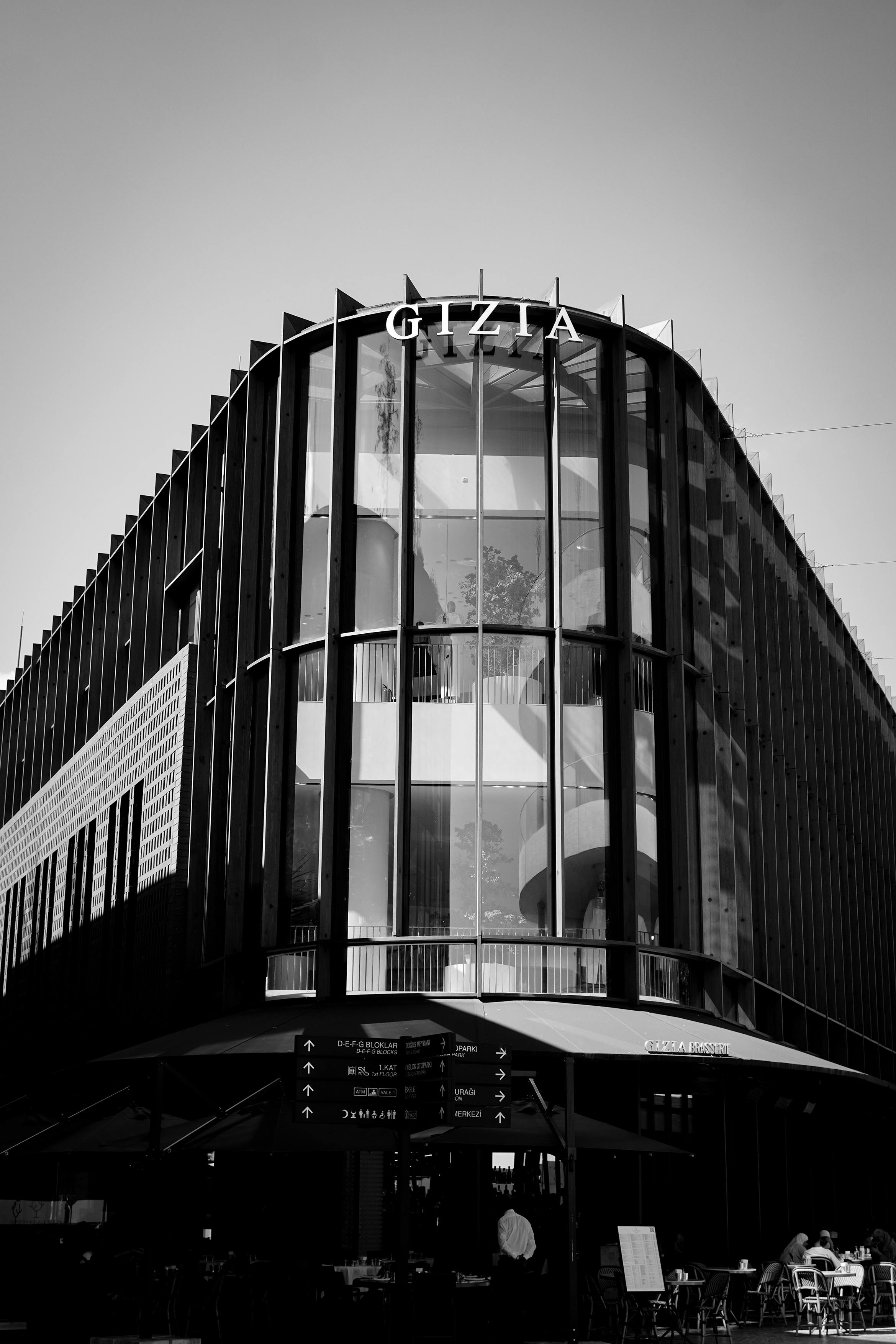 Free Black and white photo of a modern shopping center facade in Istanbul, showcasing contemporary architecture. Stock Photo