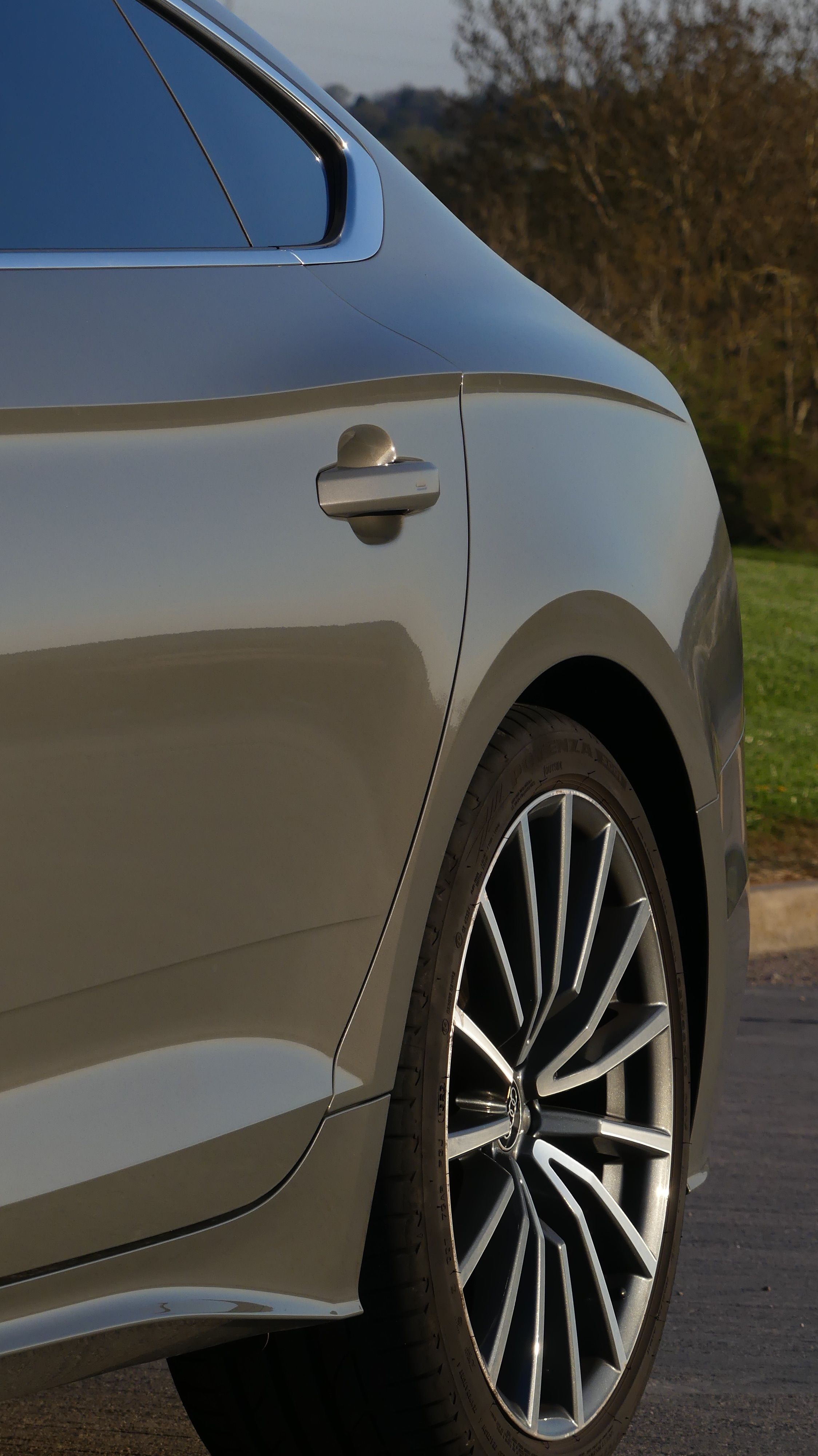 Sleek Grey Car Rear View with Alloy Wheels · Free Stock Photo
