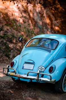 A classic blue Volkswagen parked in a serene forest in Yalova, Türkiye, showcasing retro design and charm.