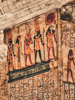 Detailed view of ancient Egyptian hieroglyphs and deities on stone temple walls, showcasing historical art.