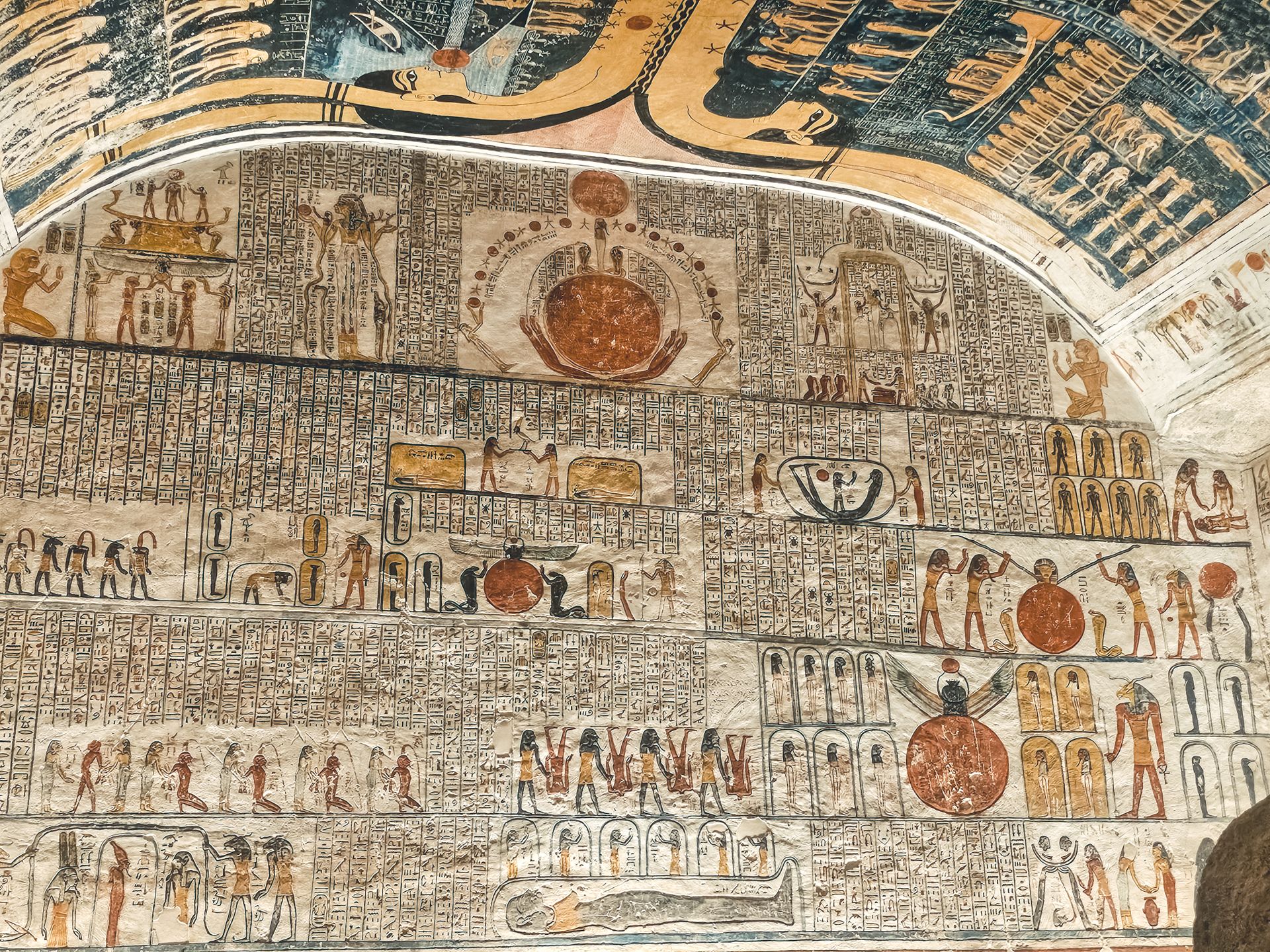 Detailed view of ancient Egyptian hieroglyphs and depictions on a historical wall.