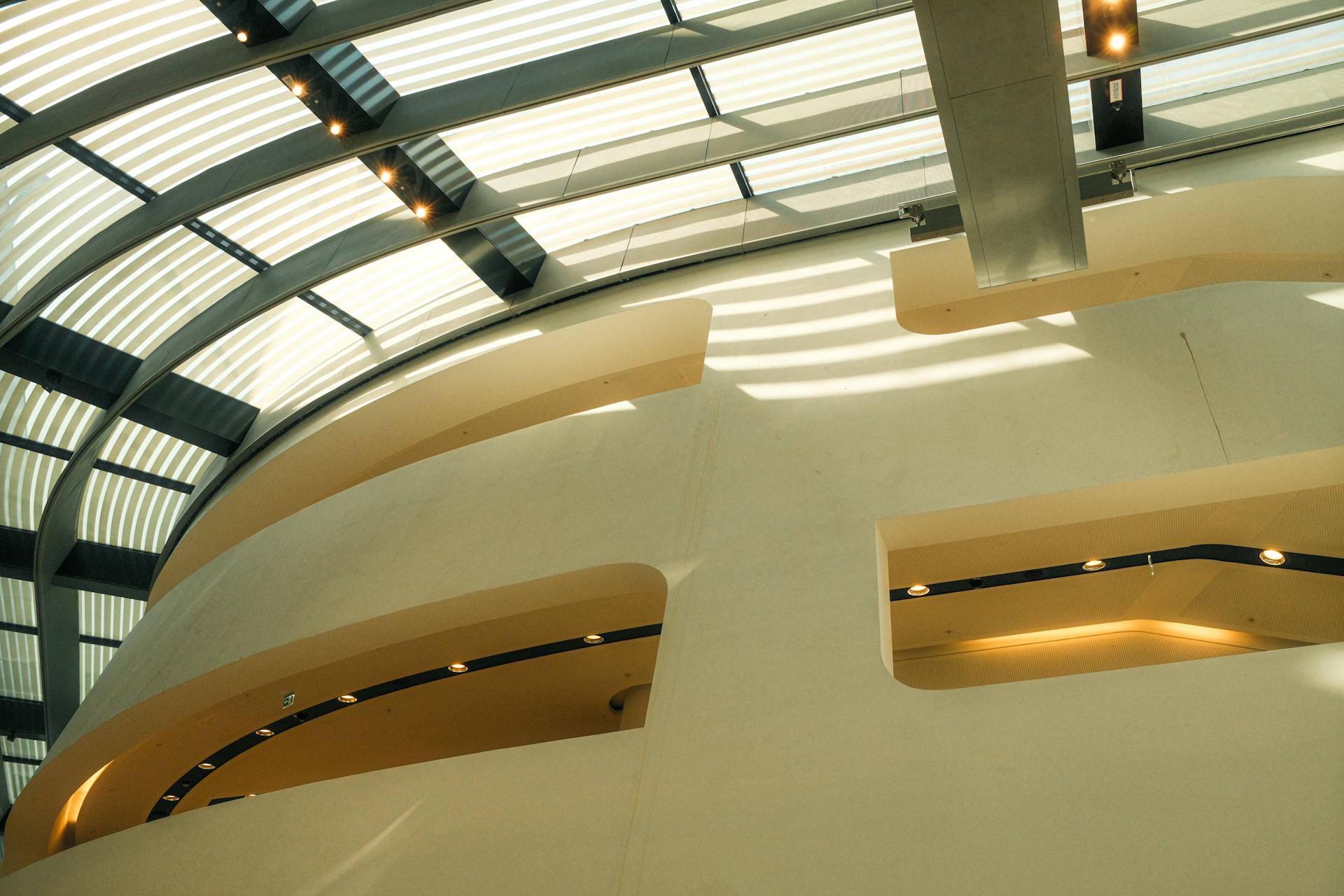 Bright interior shot featuring a modern skylight ceiling and geometric design elements.
