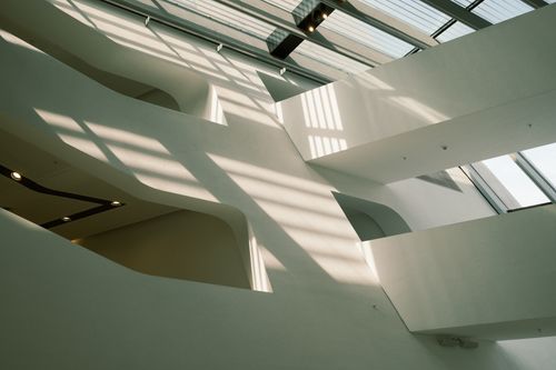 Free Minimalist indoor architecture featuring skylights and geometric shadows, perfect for design inspiration. Stock Photo