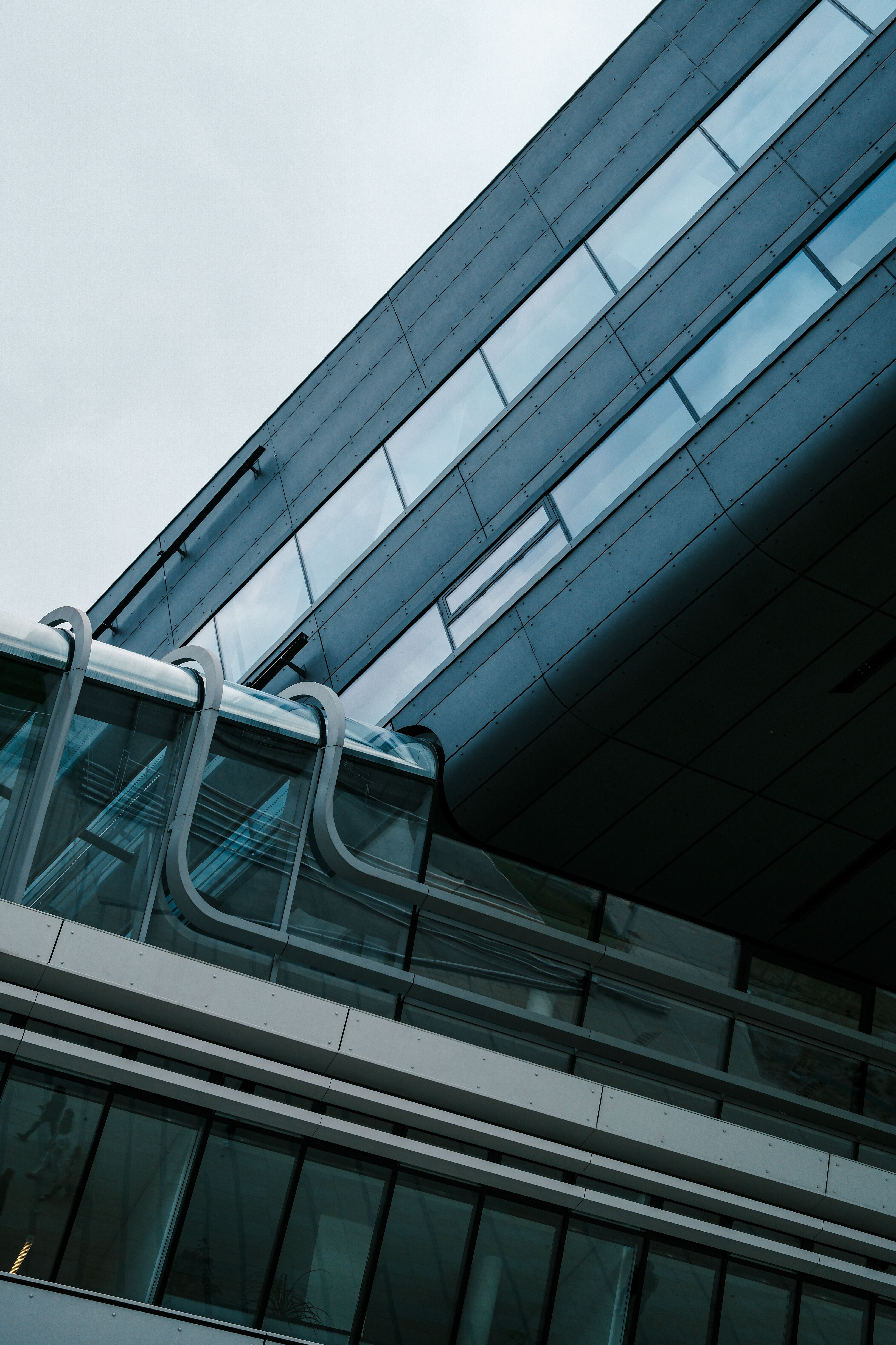Modern Architectural Building with Glass Facade · Free Stock Photo