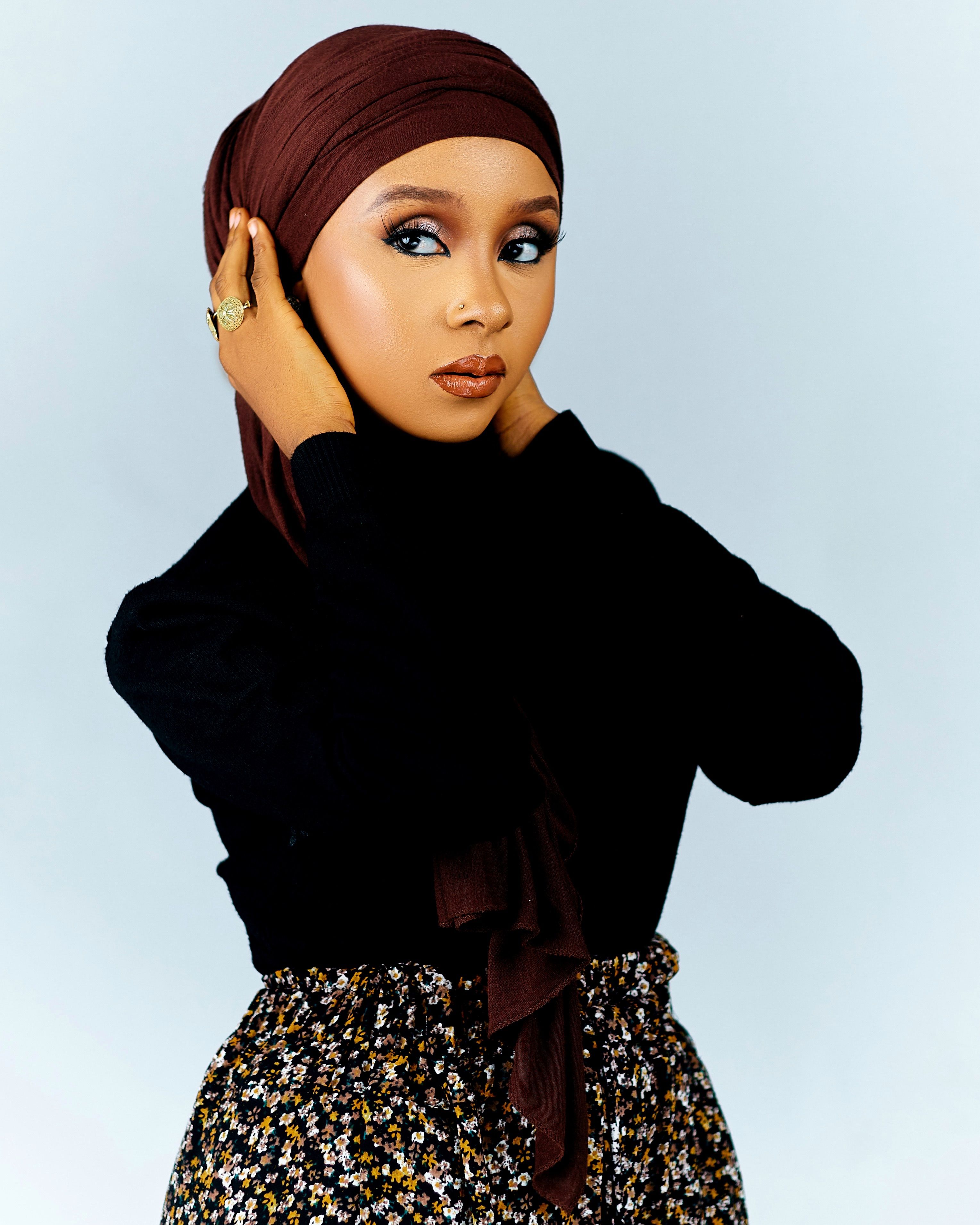 Portrait of Stylish Woman in Hijab and Floral Skirt · Free Stock Photo