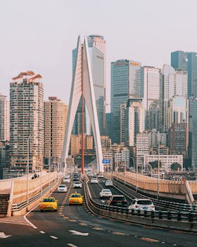 Cityscape showcasing a modern bridge and high-rise buildings on a clear day in Chongqing.