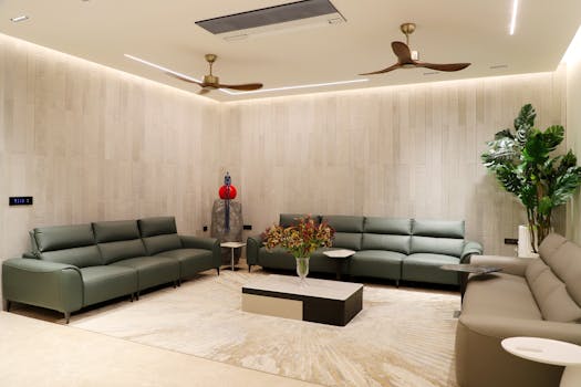 Stylish and modern minimalist living room with green sofas and elegant decor, perfect for interior design inspiration.