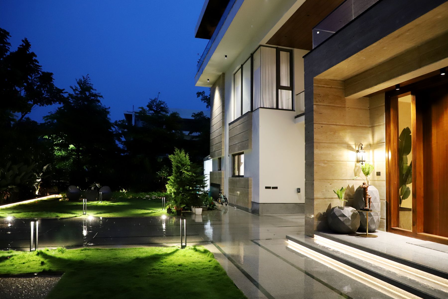 Modern luxury home illuminated at night