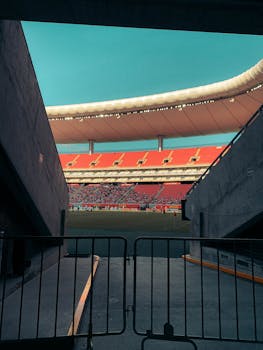 Dramatic entry view of a soccer stadium in Zapopan, Mexico during a daytime event.