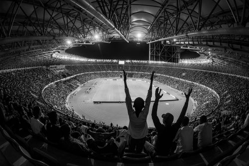 Free Black and white photo of a lively sports event at Kigali City Stadium, Rwanda. Stock Photo