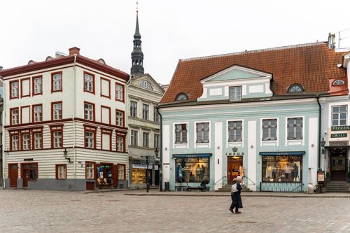 Free Discover the medieval charm of Tallinn's historic old town square with colorful buildings and cobblestone streets. Stock Photo